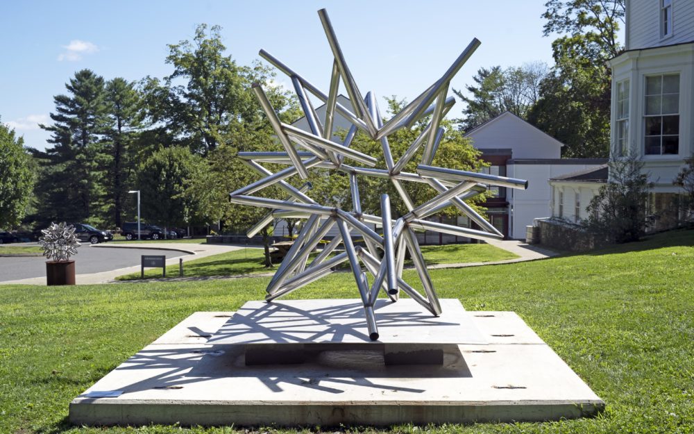 Stainless steel sculpture in form of abstract star by Frank Stella set in the lawn by Main Street in Ridgefield, CT in front of the Museum.