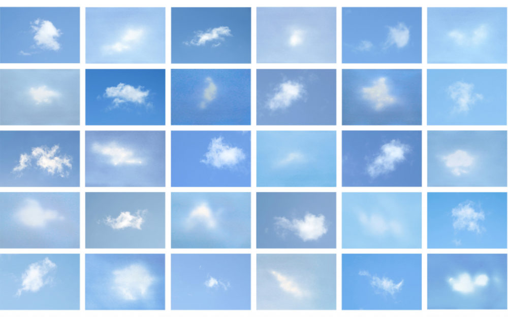 Panels of white clouds against a blue background