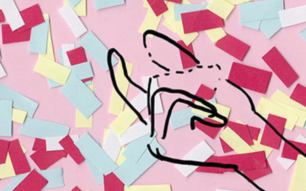 Animated hand against a pick background with shredded pieces of colorful paper