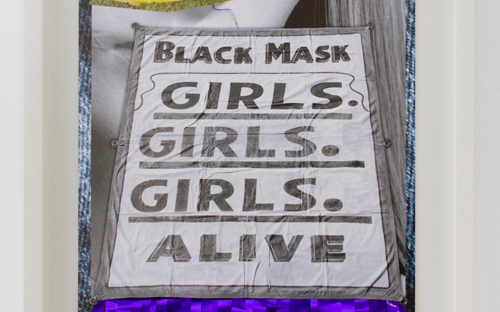 Banner reading "Black mask, Girls. Girls. Girls. Alive," in gray font