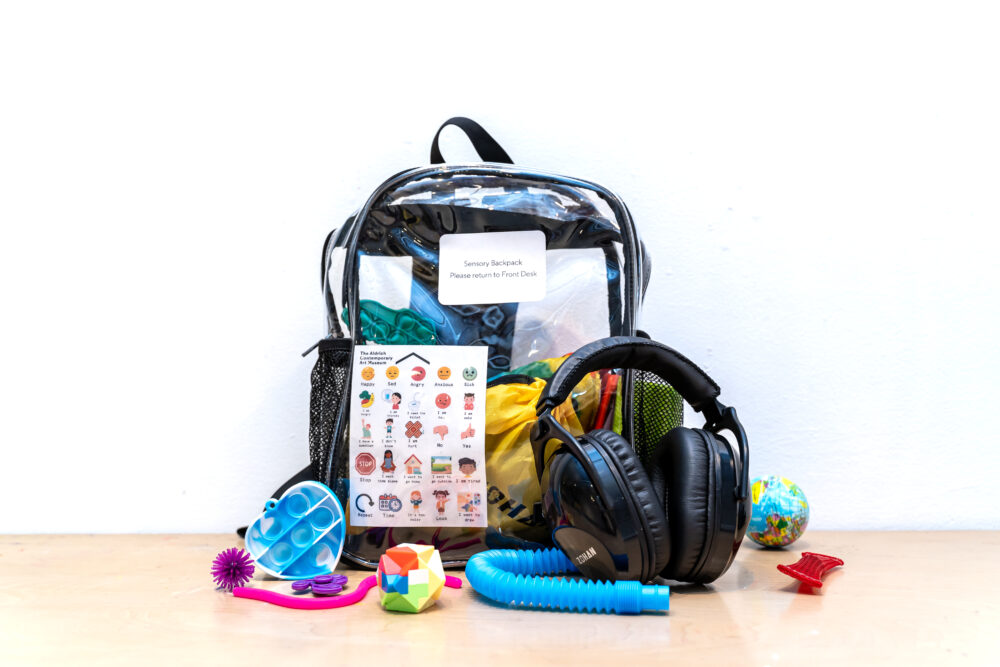 Clear plastic backpack featuring a range of sensory objects