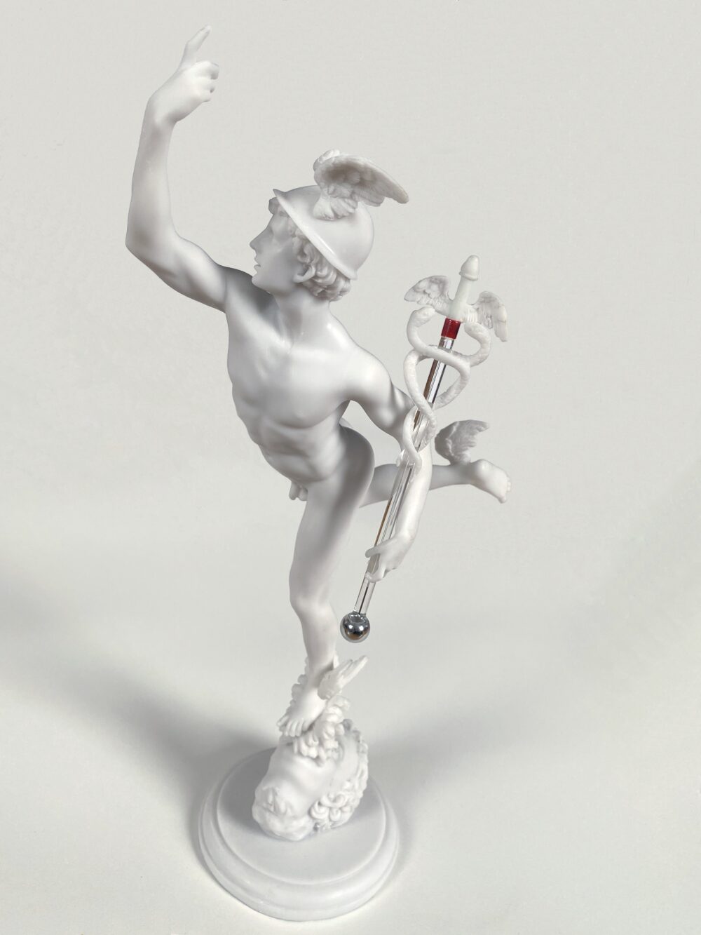 Figure of the god Mercury holding a vial of mercury.