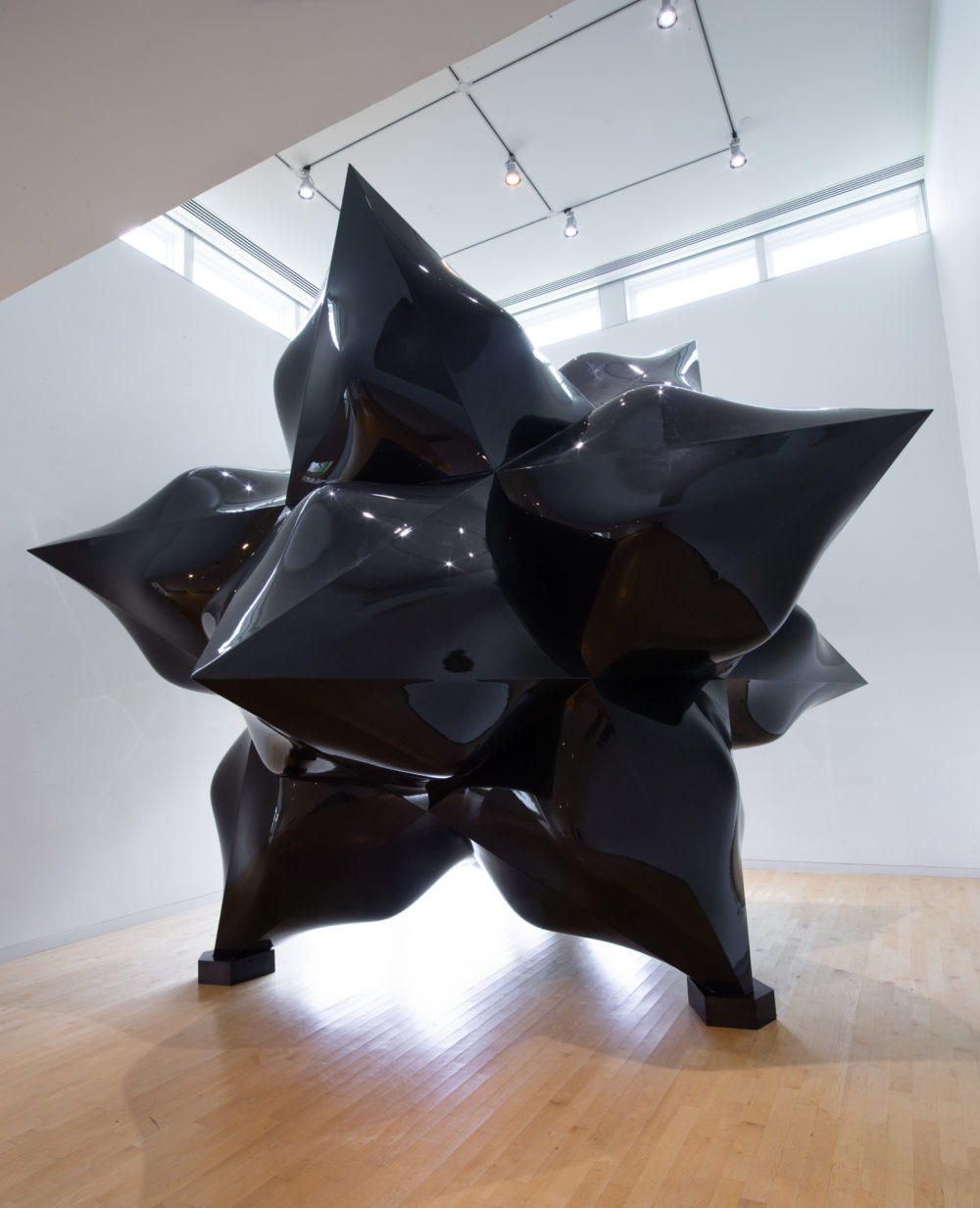 Large-scale sculpture of a black star.