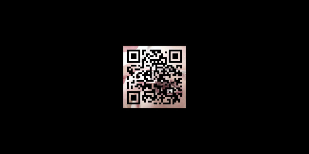 A white QR code over a square image of an eye looking through a glasses lens surrounded by a black background.