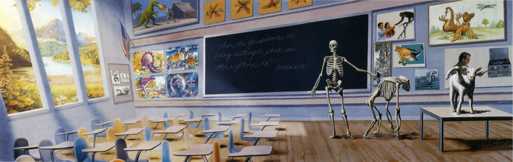 A classroom with skeletons of a human and an ape, as well as a sheep with an extra limb on a table. There is a bible verse written on the chalk board.