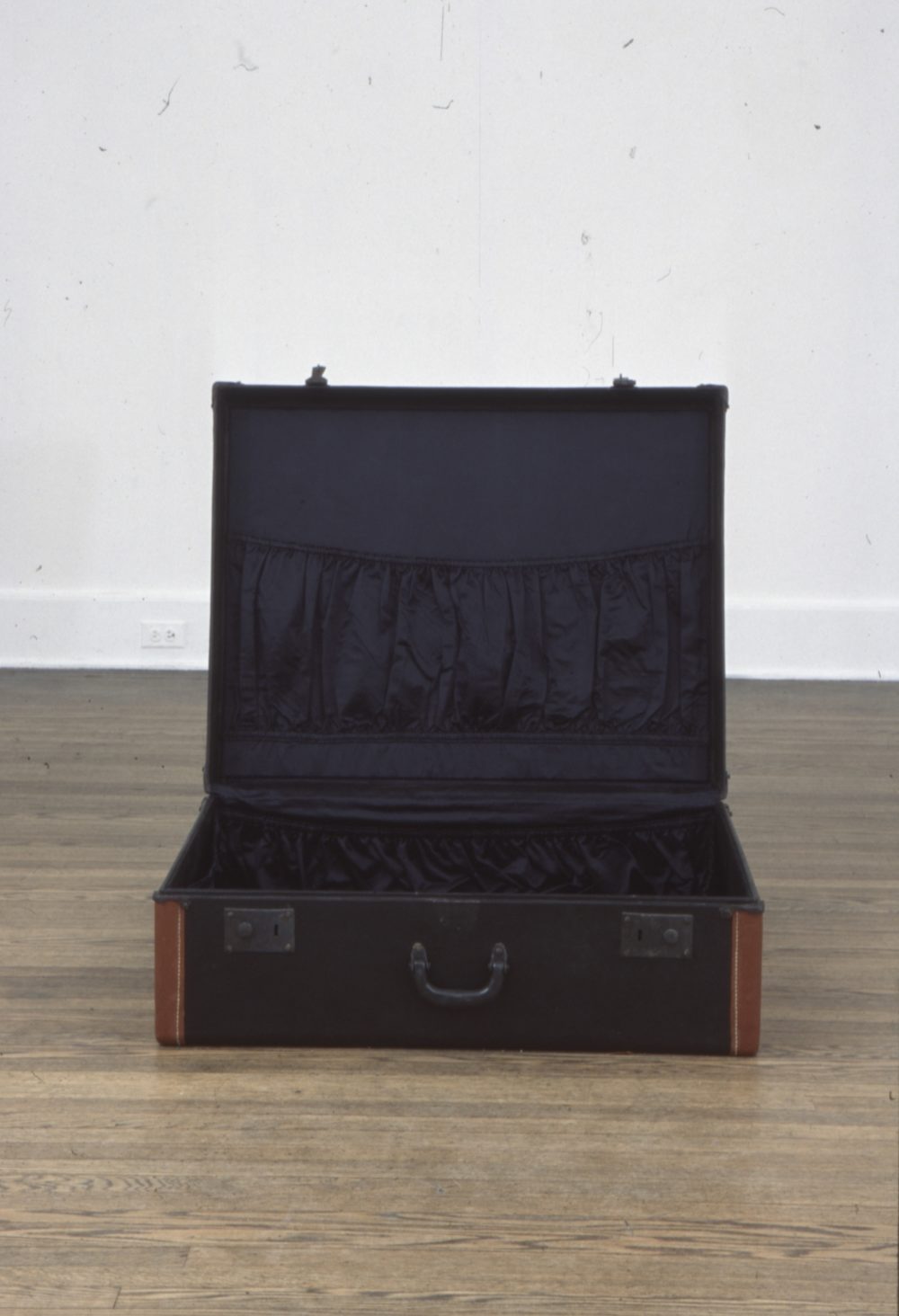 An empty suitcase on the floor