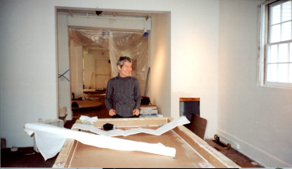 This is a photograph of Ann Hamilton in the process of installing her exhibition "whitecloth" for the Larry Aldrich Foundation Award