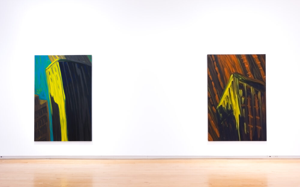 Two abstract paintings on a wall with big gestural brushwork