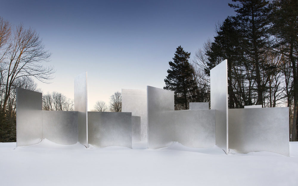 Outdoor installation: Large stainless steel rectangles arranged horizontally and vertically
