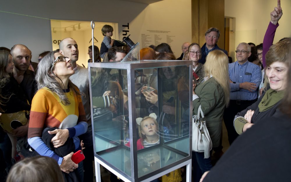 Visitors watching a performance of Sean Salstrom's Indefinity Box.