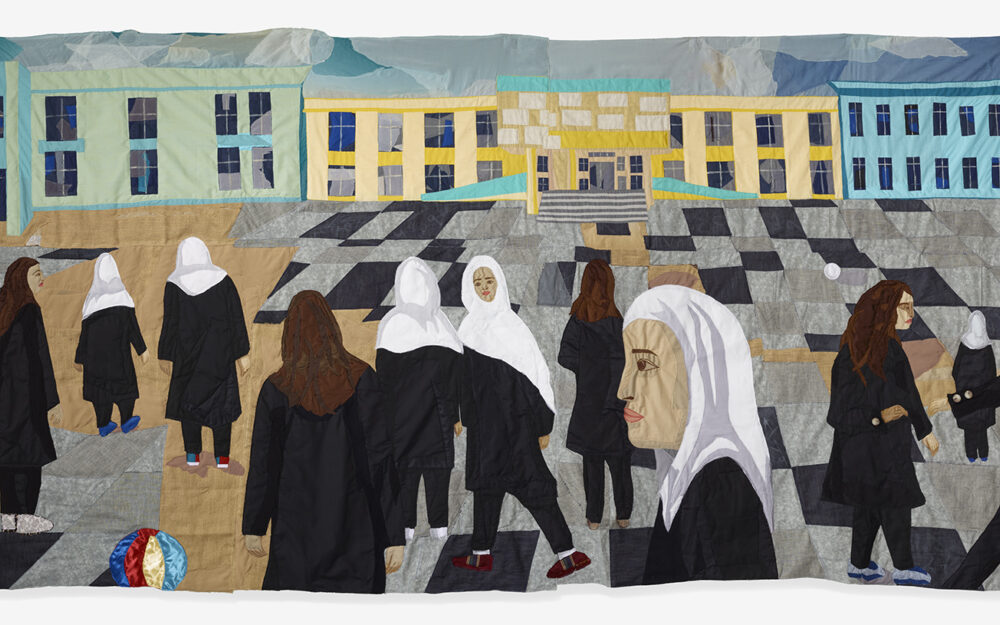 Textile work depicting women standing outside of a school.