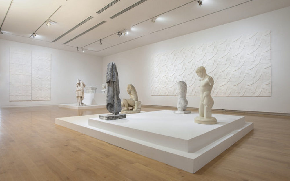 White sculptures on a platform in The Aldrich's gallery