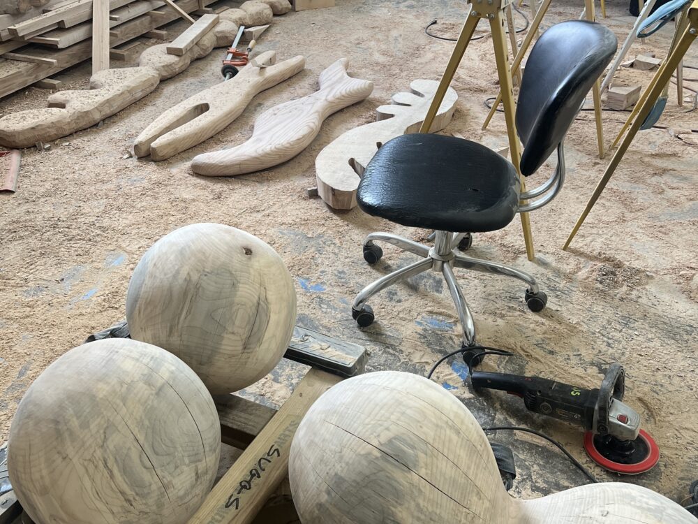 A wood shop with various shaped pieces.