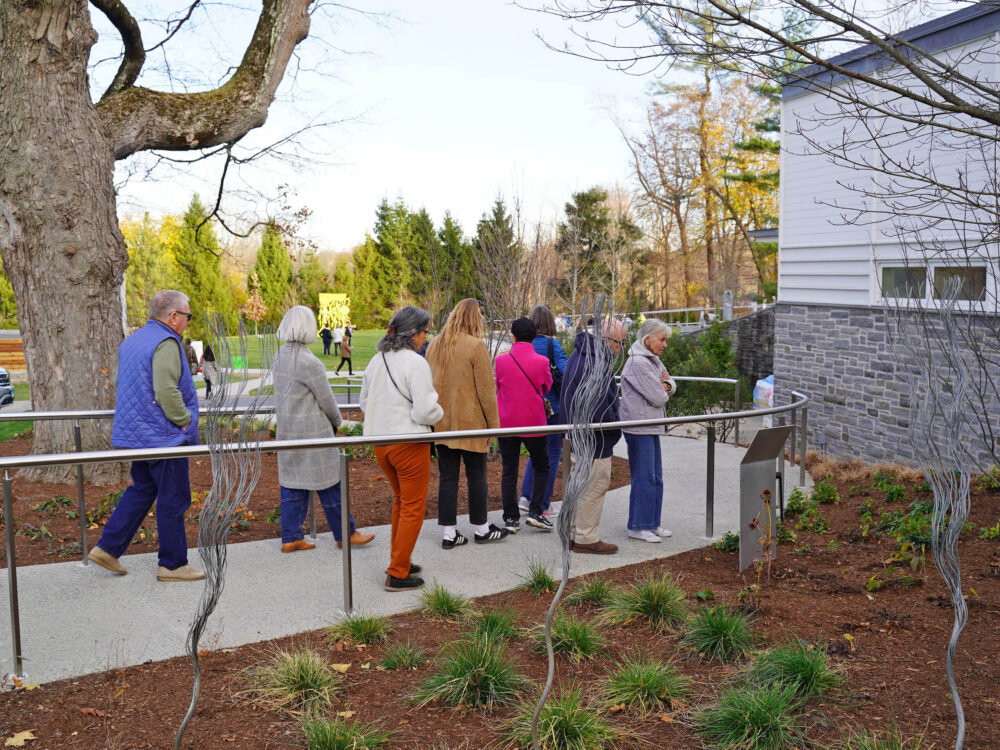 visitors on a tour of the museum grounds