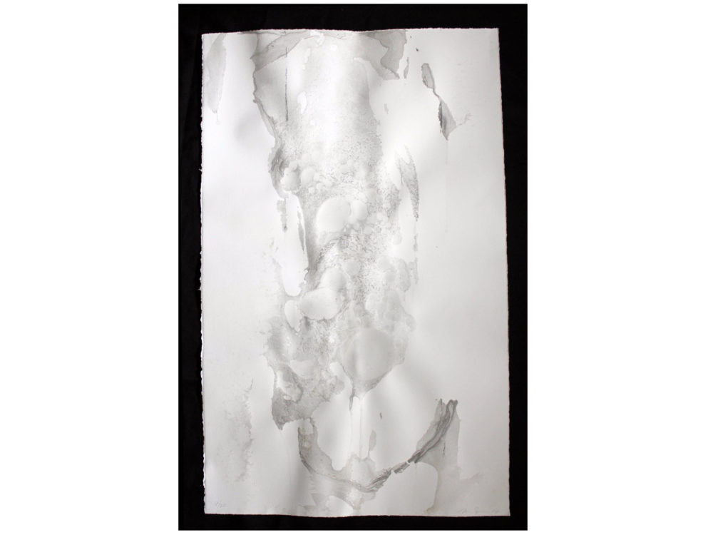 Abstract mottle of silver on white paper ground.
