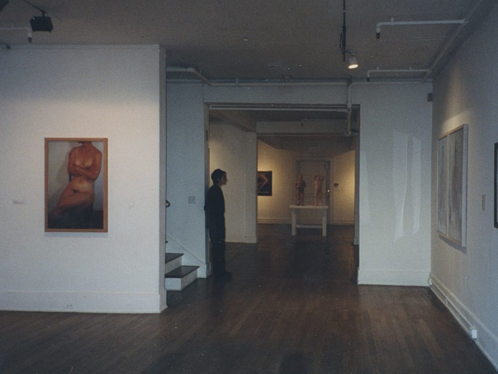 A photo from the exhibition The Nude in Contemporary Art, featuring a large photo of a nude woman