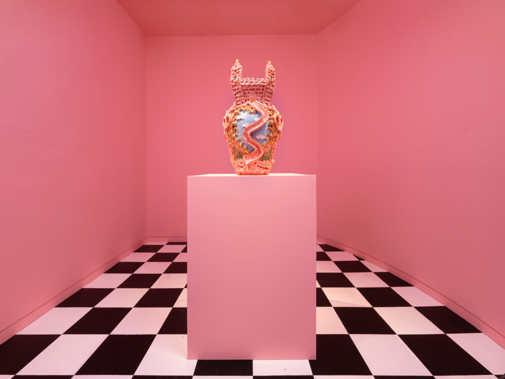 A pink room with a black and white checkerboard floor with a ceramic object on a pedestal at the center.