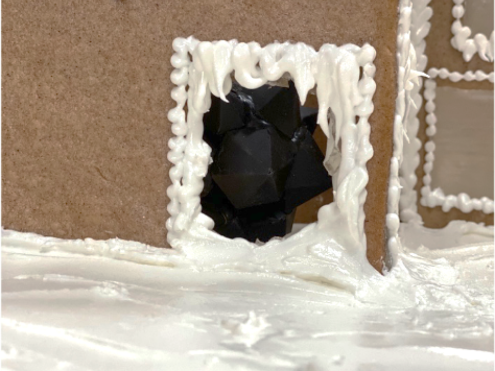 Recreation of Frank Stella's Fat 12 Point Carbon Fiber Star through a gingerbread window